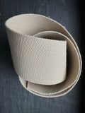 woven hemp webbing wide piece on dark slate surface