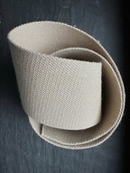 woven hemp webbing wide piece on dark slate surface