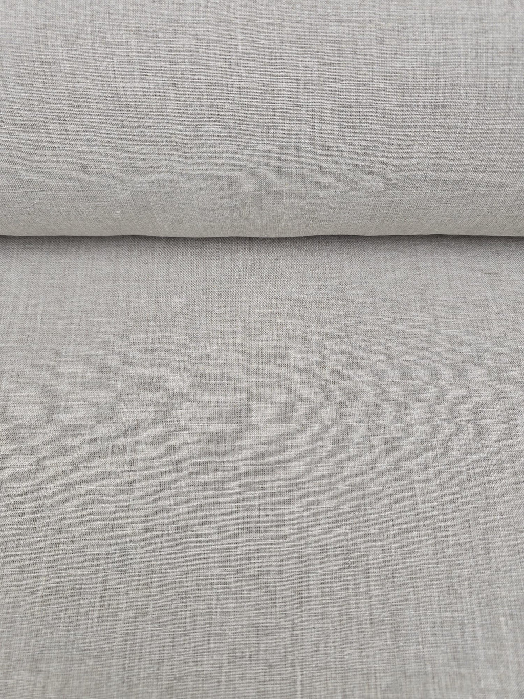 Close-up of roll of Juniper hemp natural fabric with a subtle texture