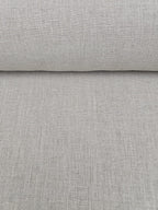 Close-up of roll of Juniper hemp natural fabric with a subtle texture