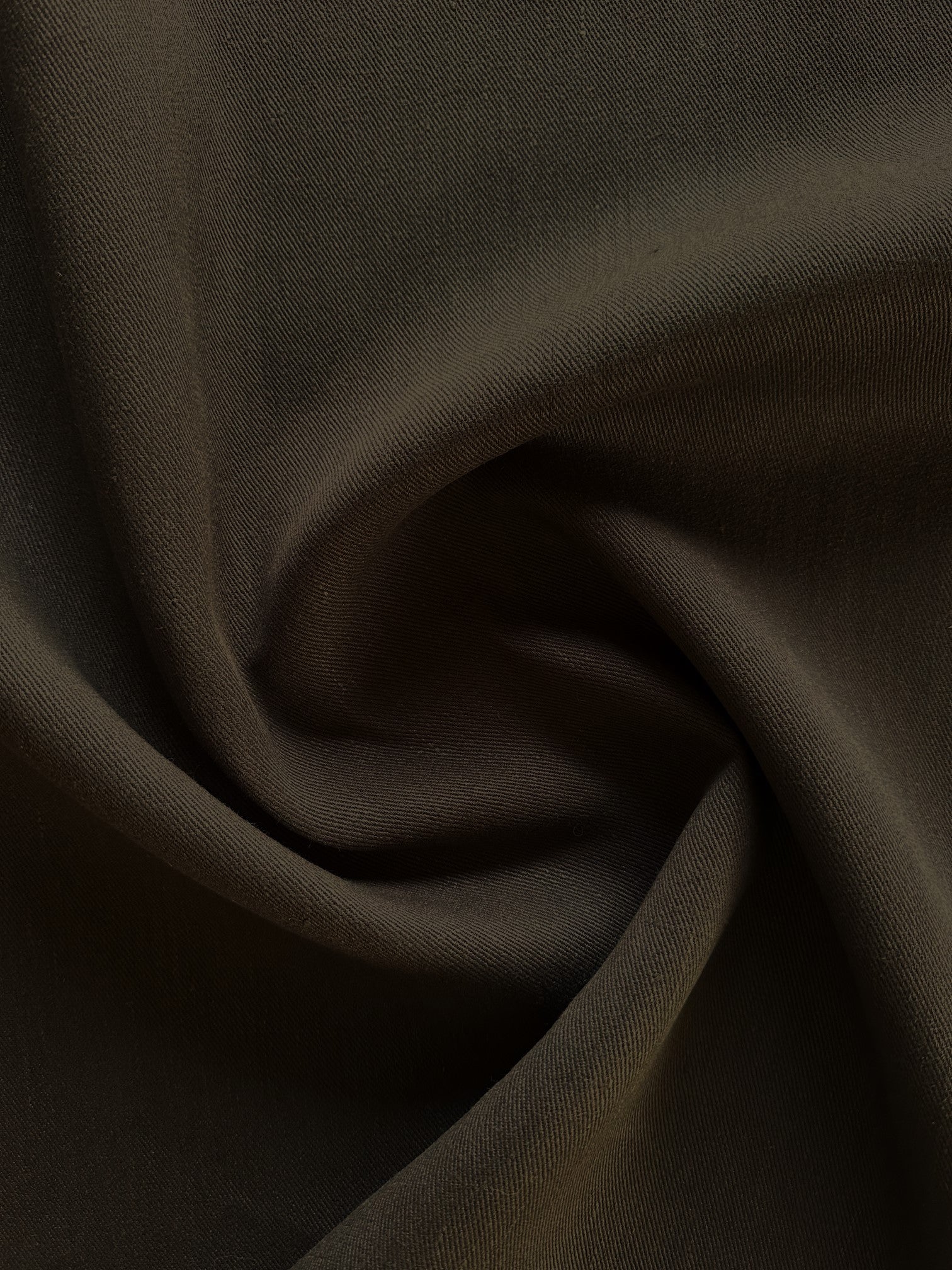 Close-up of Cairn chocolate brown hemp twill fabric with folds