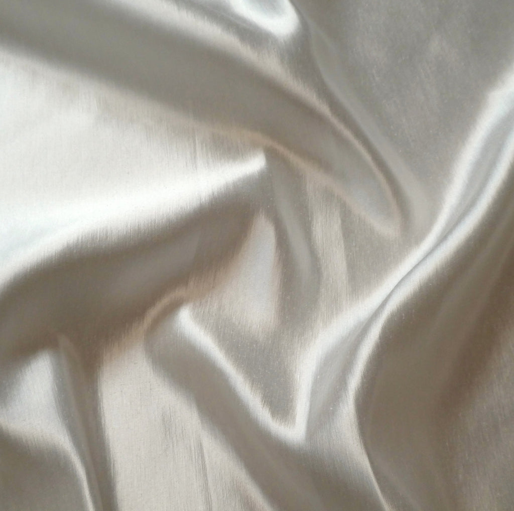 Close-up of ivory Glint hemp and silk fabric with subtle texture