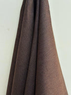 Dama Chocolate Brown hemp fabric draped against a white background