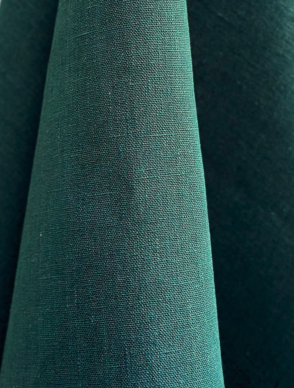 Close-up of Dama teal hemp fabric with a textured surface