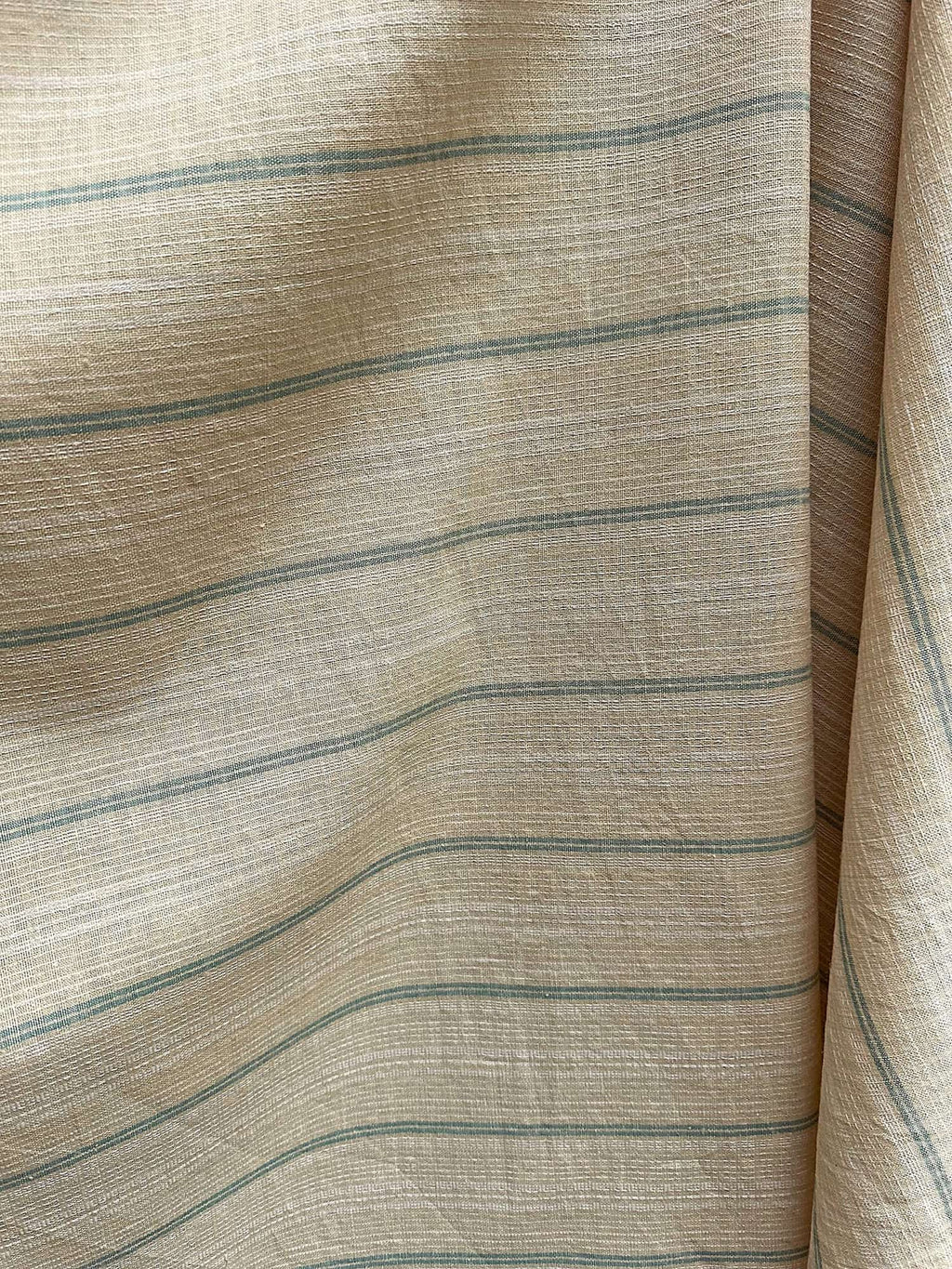 Close-up of striped Dune hemp fabric with beige and blue lines