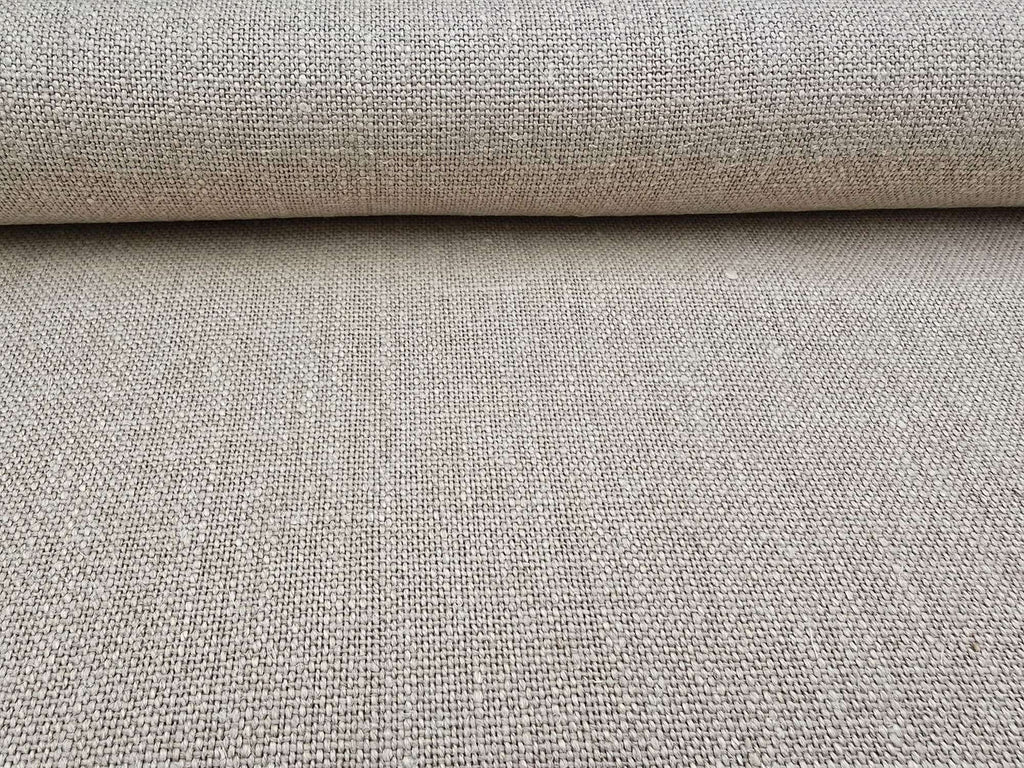 Close-up of a roll of natural Terra hemp fabric with a textured surface.