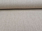 Close-up of a roll of natural Terra hemp fabric with a textured surface.