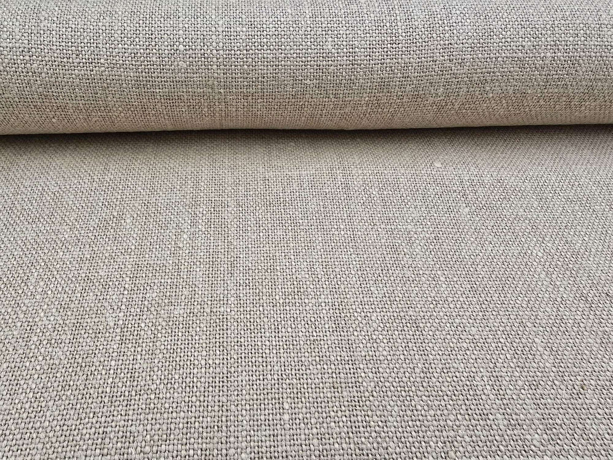 Close-up of a roll of natural Terra hemp fabric with a textured surface.