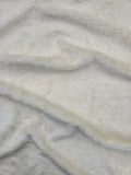Cosmos faux fur hemp fabric in cream close up