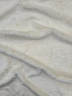 Cosmos faux fur hemp fabric in cream close up