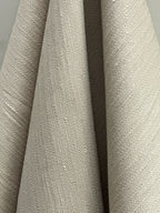 Close-up of textured herringbone hemp fabric Hampa with a neutral color palette