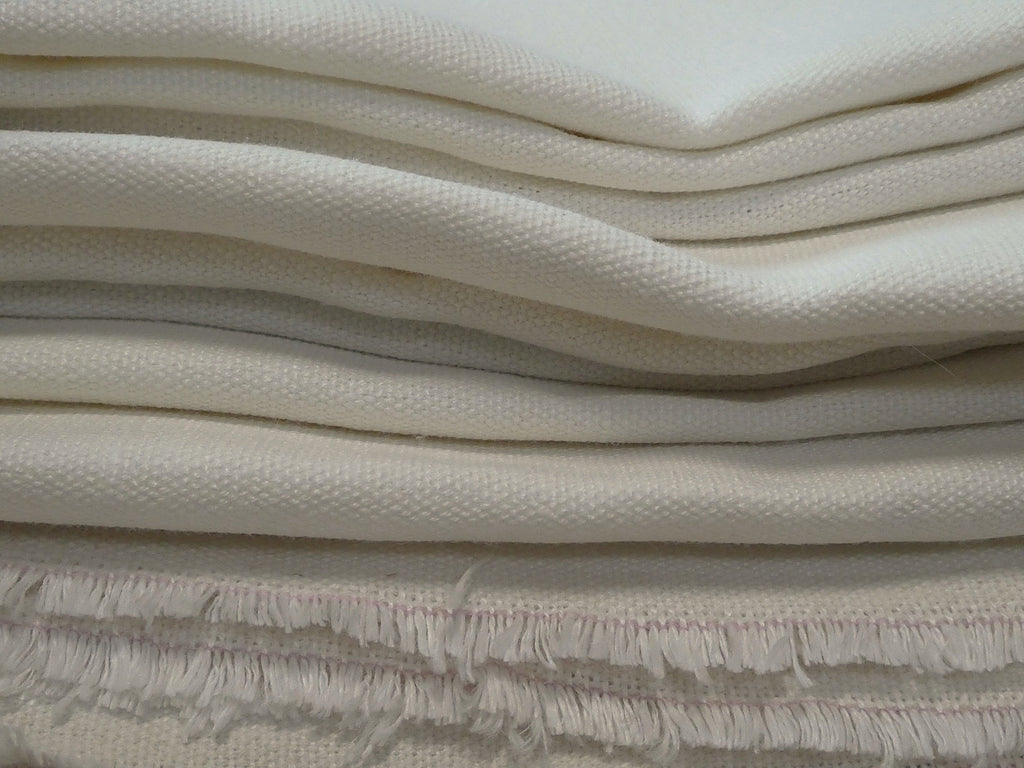 folded pile of Tarn hemp fabric in ivory