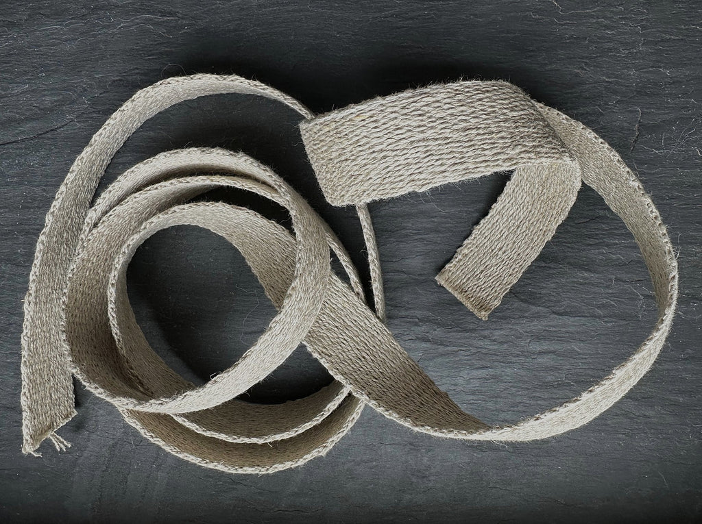 Herringbone hemp natural webbing on dark slate background
