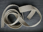 Herringbone hemp natural webbing on dark slate background