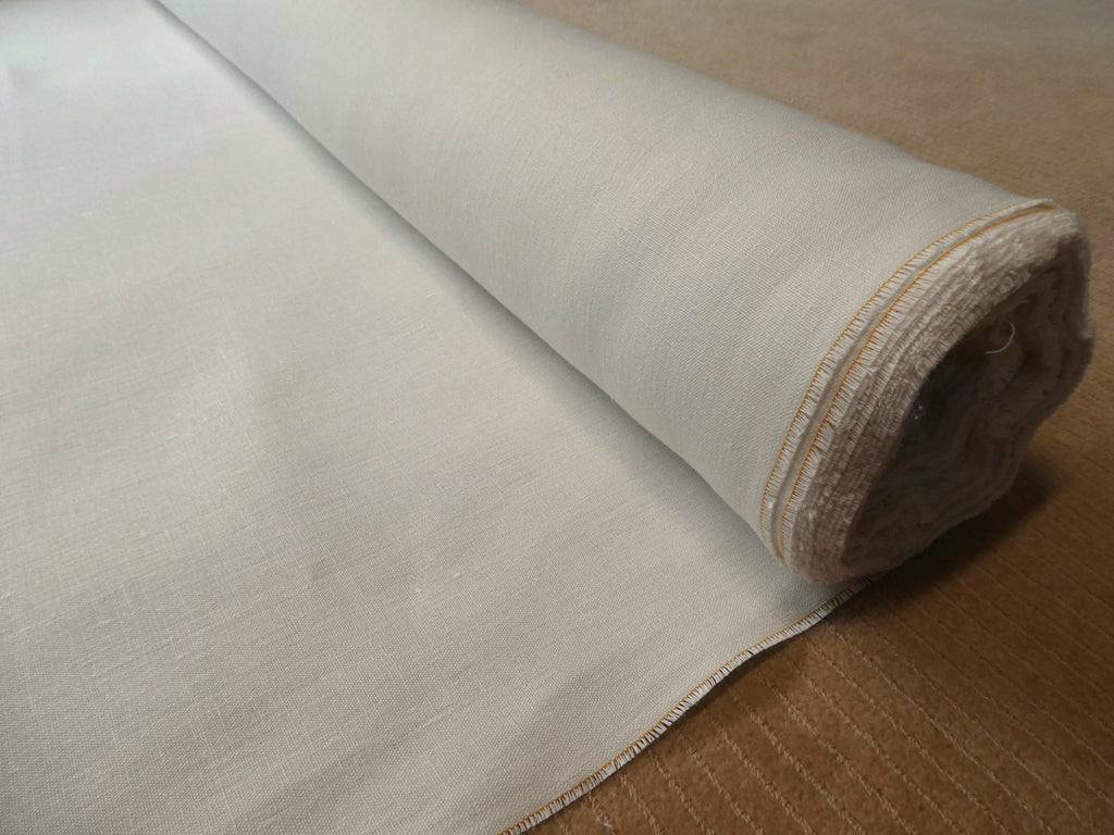 Mesa hemp and cotton canvas fabric roll against beige carpet background