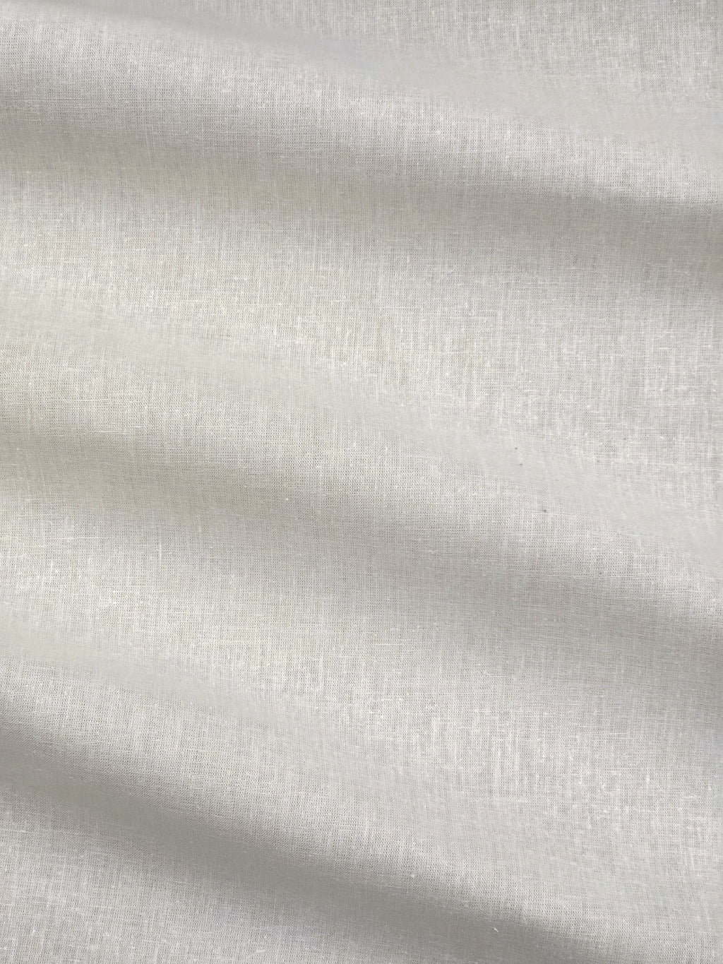 Close-up of ivory meadow hemp and cotton fabric with subtle texture